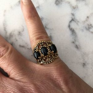 Ladies gold tone and colored stones ring